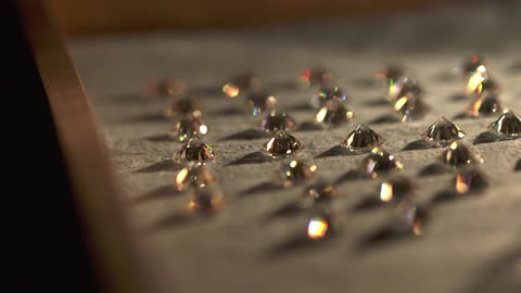 Surface with many shiny jewels laid across it