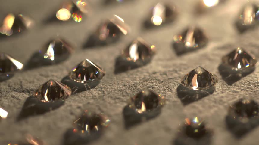 Light reflects off of rows of diamonds