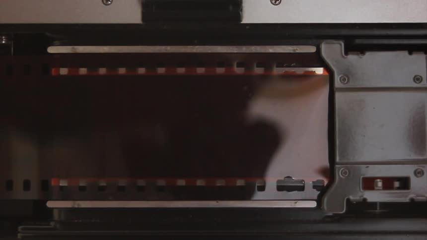 Someone inspecting film