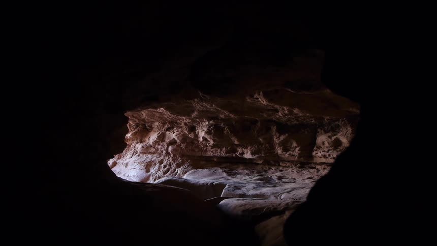 Light shines into a deep cave