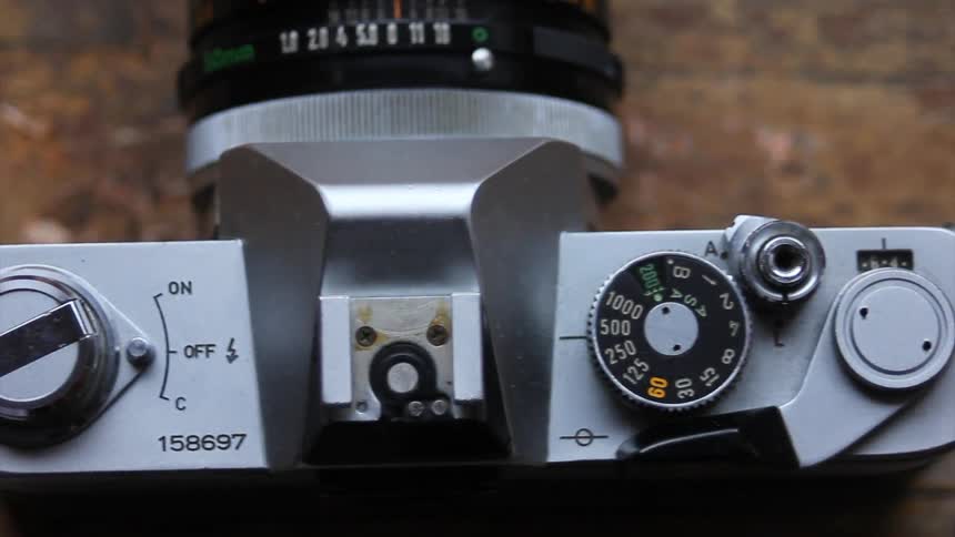A close up view of a camera and a workbench