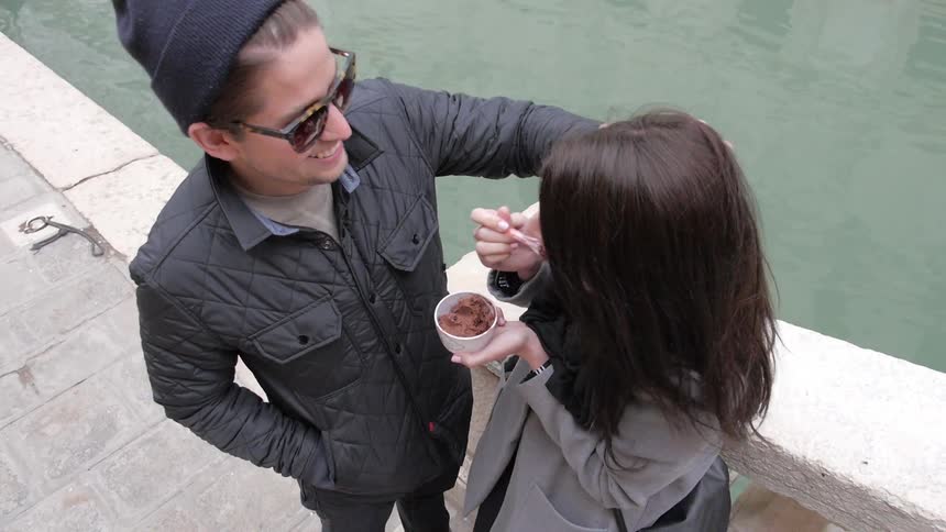 Woman tries to share ice cream with significant other