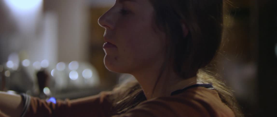 Person working as she turns to smile