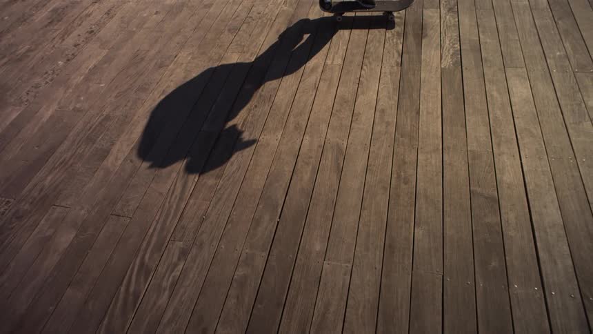 The shadow of a man skateboarding