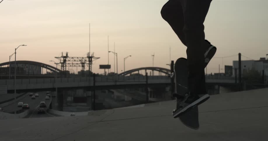 Man doing a skateboard trick on a cloudy day