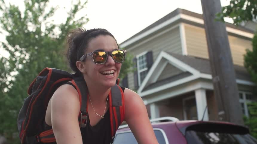 Woman smiling as she travels on a sunny day