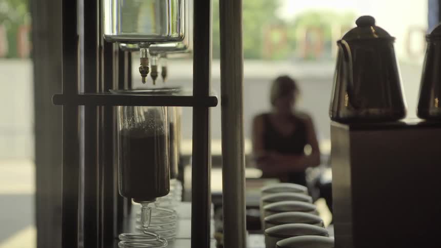 A woman sits in a coffee shop