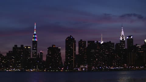 View of a brightly lit city at sunset