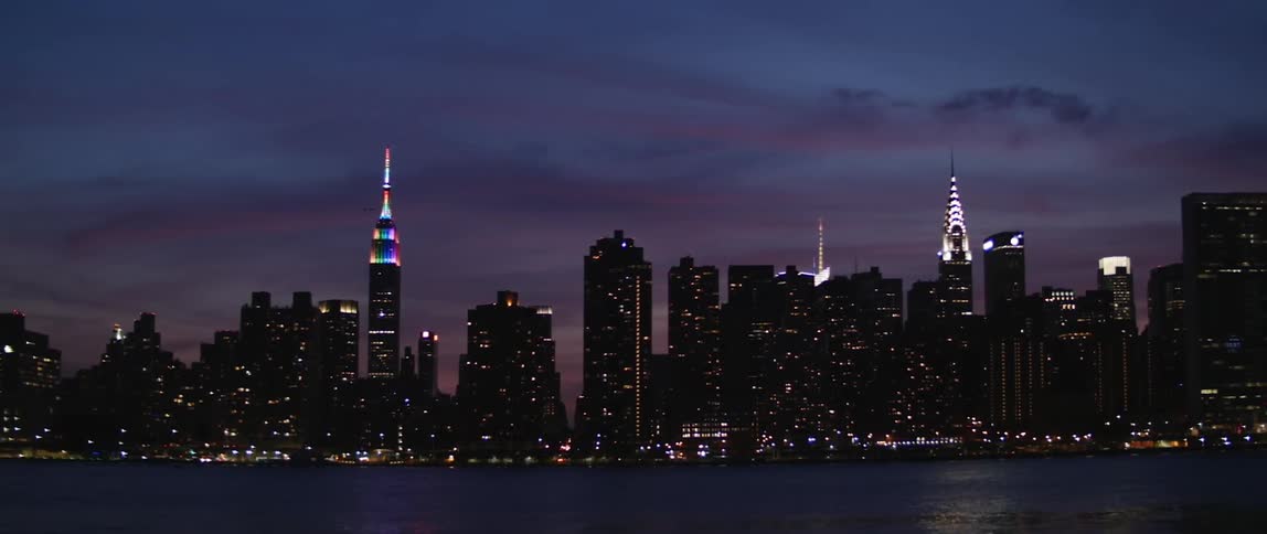 View of a brightly lit city at sunset