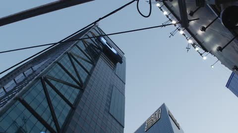 A skyscraper looms overhead