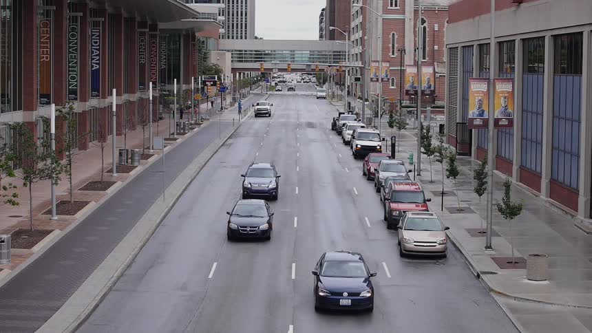 Cars driving down a city street