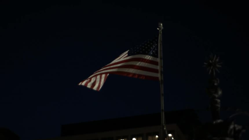 An american flag billows in the wind