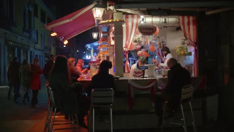 A juice stand at night
