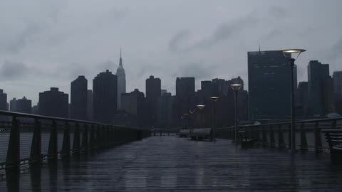 Time-lapse of clouds moving across the sky of a large city