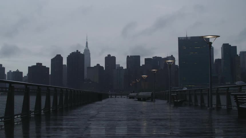 Time-lapse of clouds moving across the sky of a large city