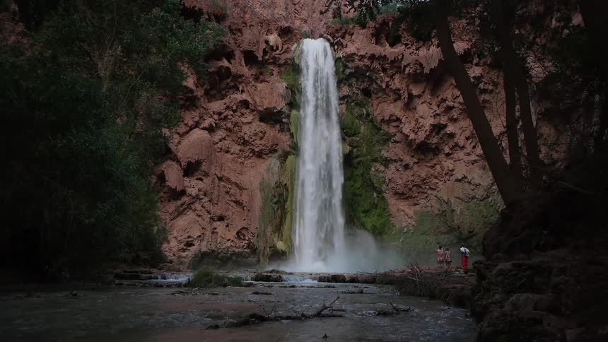 View of a waterfall pouring into a stream