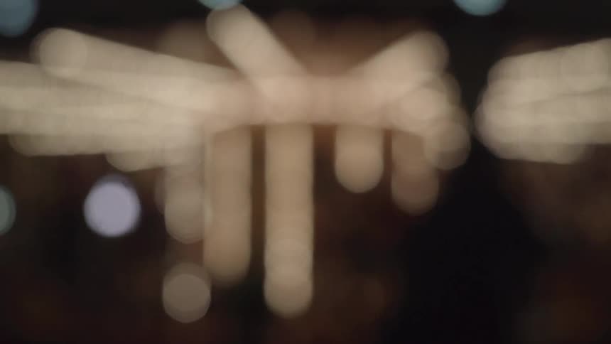 A turning merry-go-round shines at night