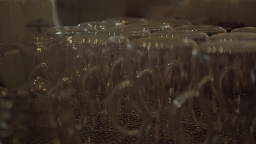 Many glasses with handles on a table
