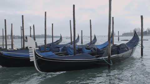 Canoes float on choppy water