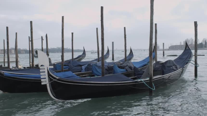 Canoes float on choppy water