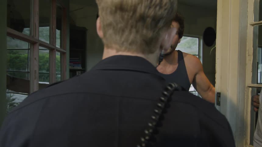 Man speaking with police officers before running from them