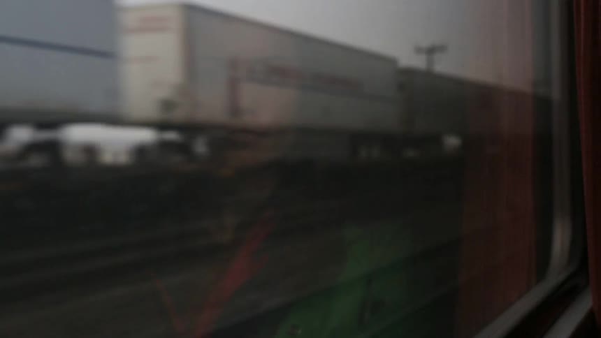 Woman's reflection from a moving trains window