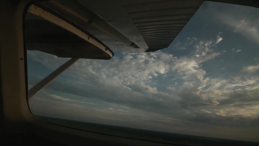View of clouds out of a small plane's window