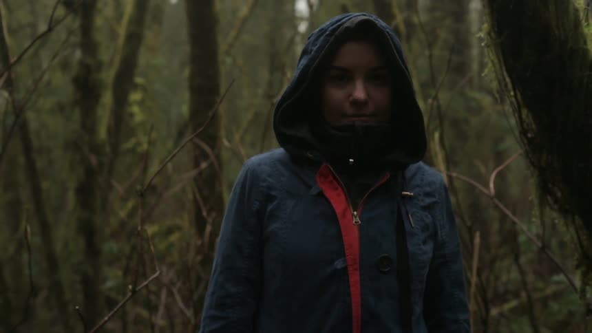 Woman standing in a forest