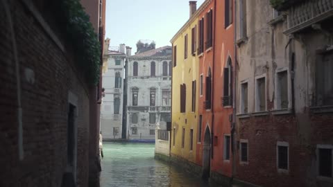 A canal flows through city buildings