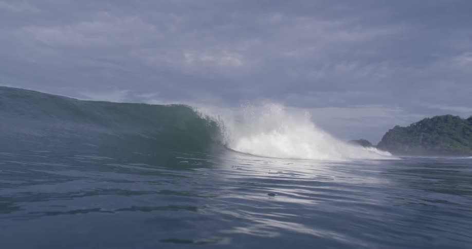 A partially underwater view of waves rolling in to shore