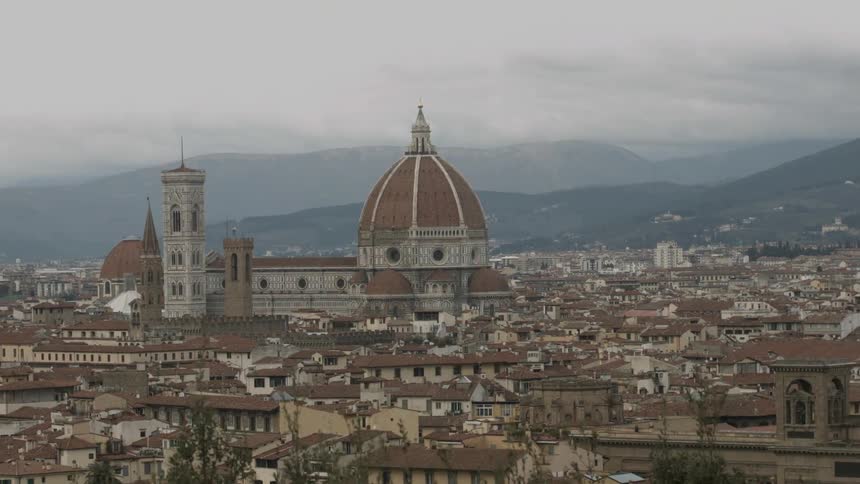 A domed city building looms in the distance