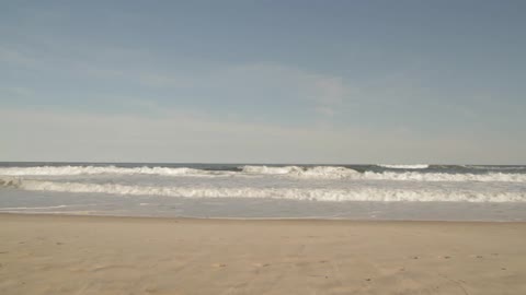 Waves rolling on to a beach