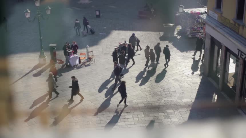 Overlooking a marketplace with people walking by