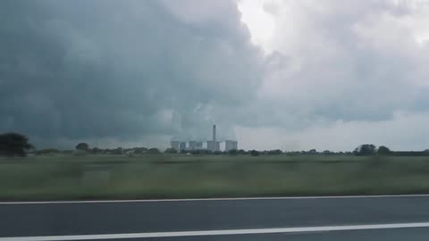 Heavy smoke coming from a plant in the distance