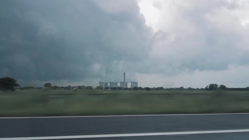 Heavy smoke coming from a plant in the distance