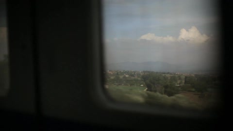 View out of window of traveling train