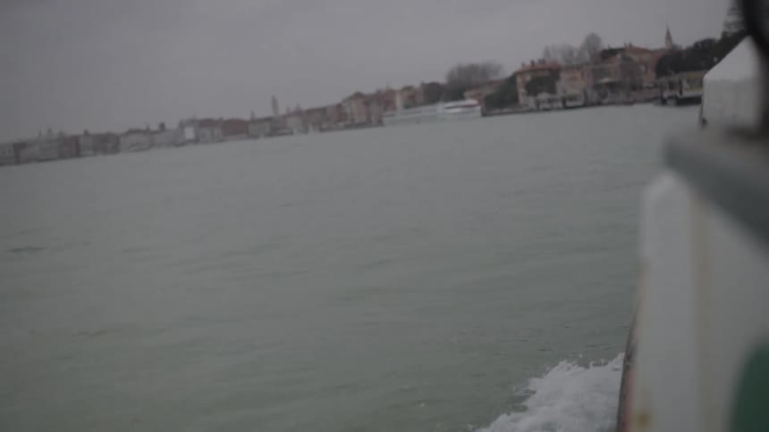 Boat traveling on water on a cloudy day