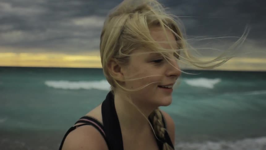 A person hair blows in the wind