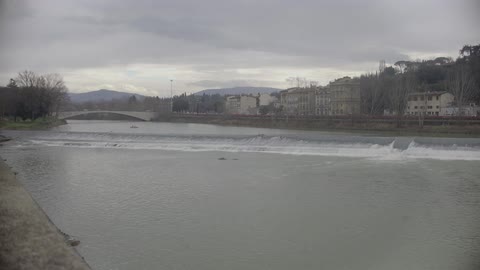 Town across from water on a cloudy day