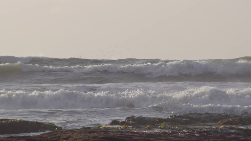 Rocky beach with fast crashing waves