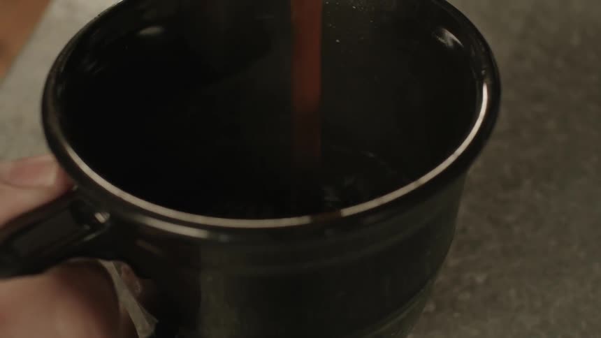 Coffee being poured into a cup