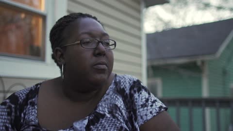 A person sitting on a porch