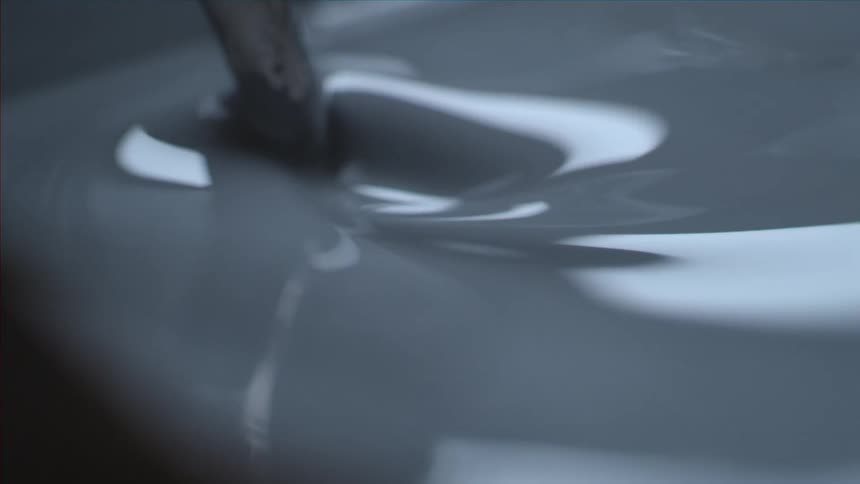 Close up of a thick liquid being stirred