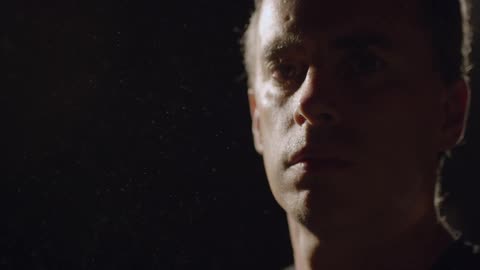A person standing in front f a light