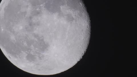 Close up view of the full moon against pitch black space