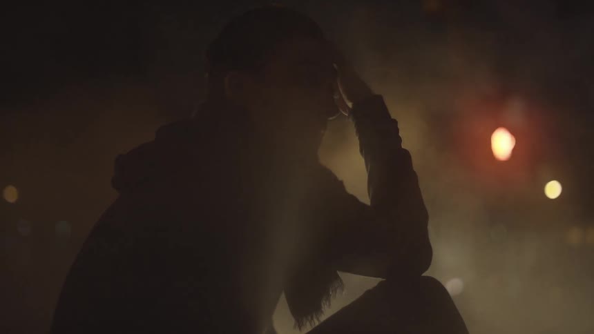 A person sitting in the fog