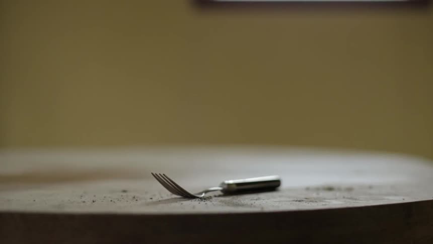 A fork on a table indoors
