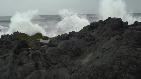 Waves crashing against rocks