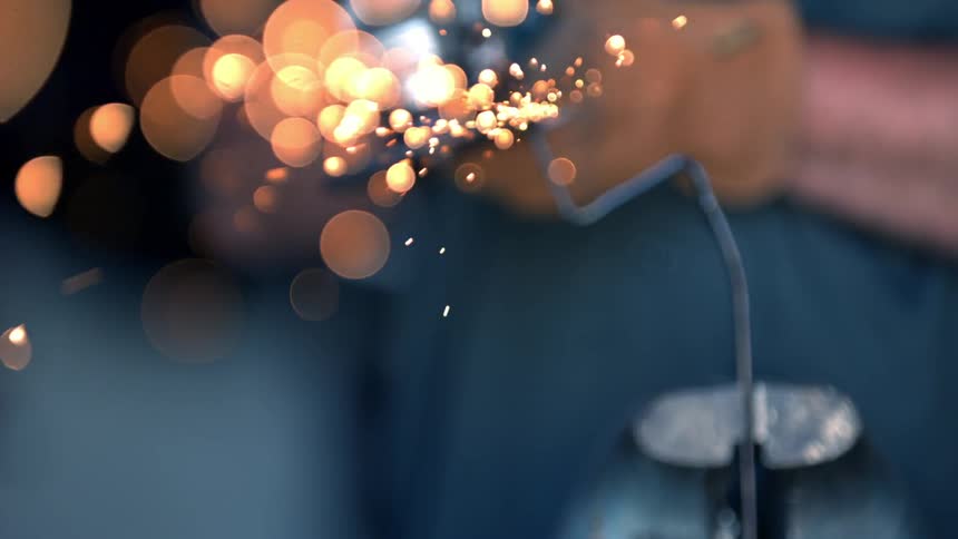 Sparkles of light coming from the end of a weld