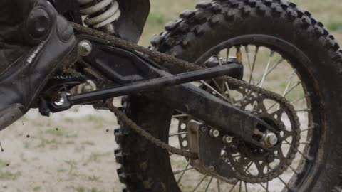 Mud spraying off of the tire of a dirt bike